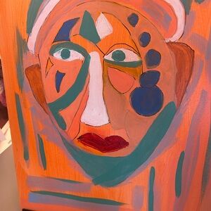 Vibrant Abstract Face Canvas with Orange and Blue Accentsnurse